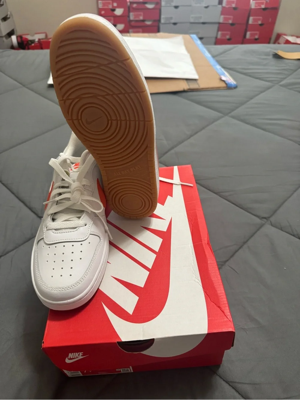 Nike Kids White Sneakers with Orange Swoosh Accent